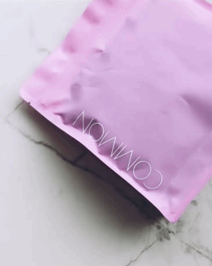 Gourmet Grocer Common Ground Coffee in pink packaging