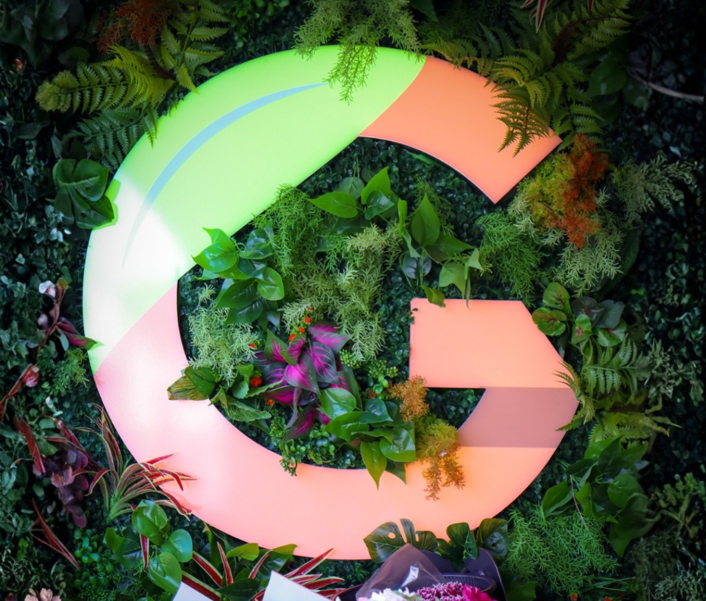 gourmet grocer sign on greenery